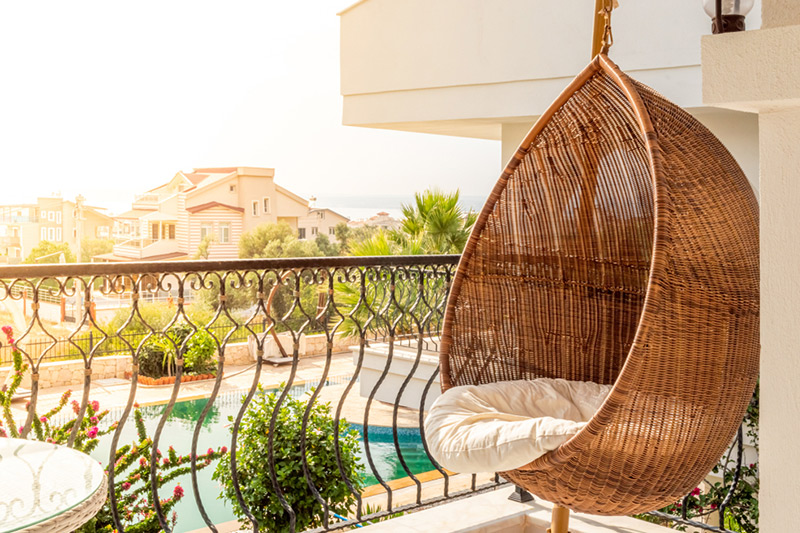 Hanging balcony chair or hammock which is comfortable and free up floor space