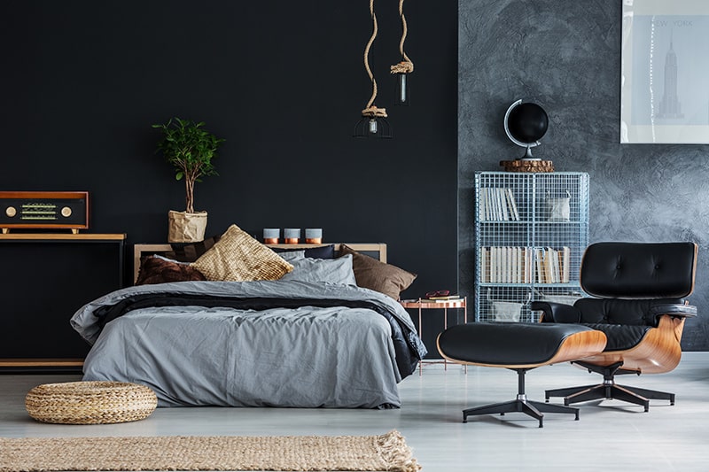 Paint your bedroom wall with black to create a stylish and trendy bedroom