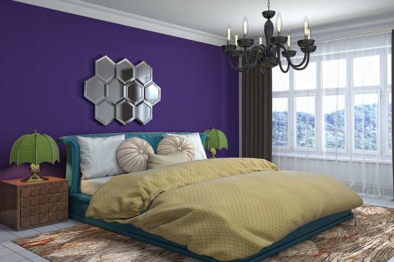 Indian style bedroom interior design with a mix of bold colours and ethnic prints