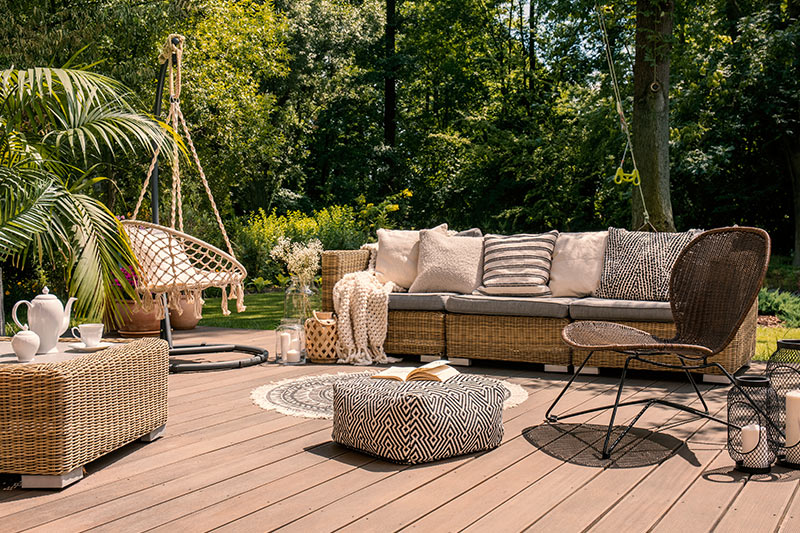 Living room outdoor design with a rattan sofa and table to make a beautiful outdoor