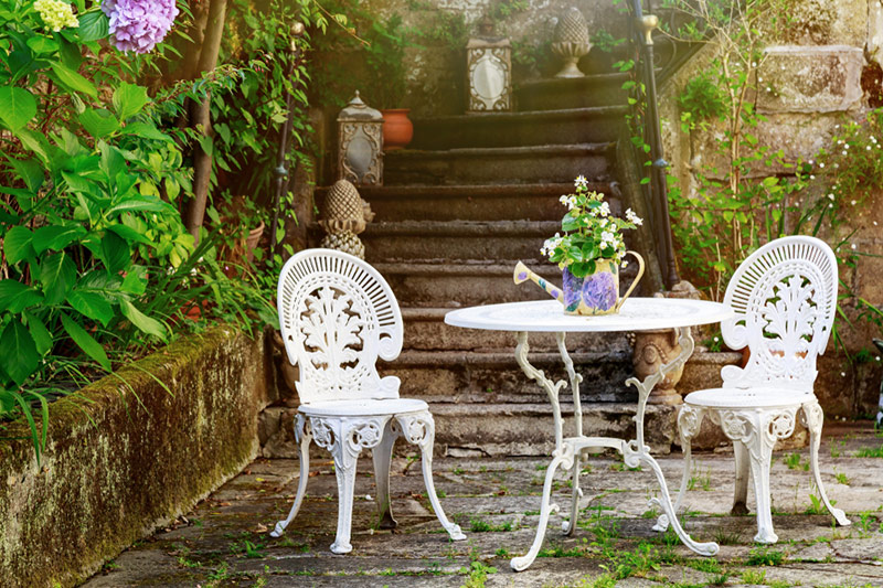 Outdoor balcony chairs and table made up of wrought iron that elevates the look of your balcony