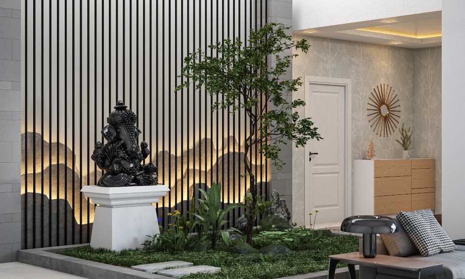 Vastu Ganesha Entrance in drawing room with a golden statue of vastu ganesha photo