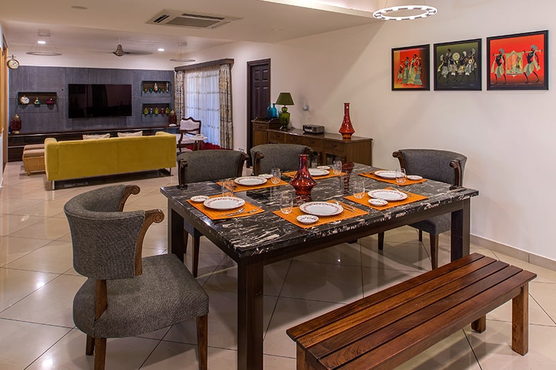 Wood dining table with benches add a unique touch to your dining room interiors