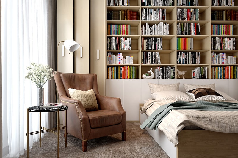 Personalised bedroom with a book shelf and armchair