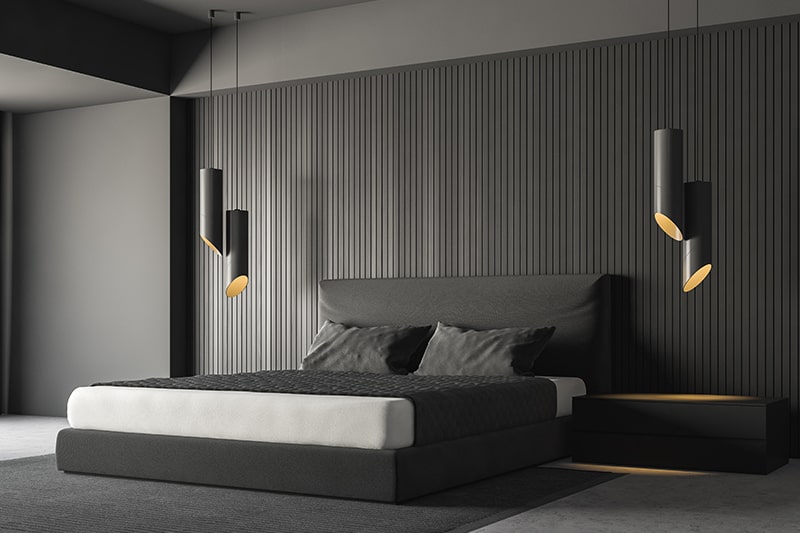 Black bedroom walls with wooden or metal stripes instead of painting in black