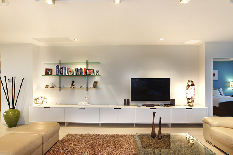 Living room shelves where a transparent material that blends seamlessly into the environment for a light of glass shelves for living room