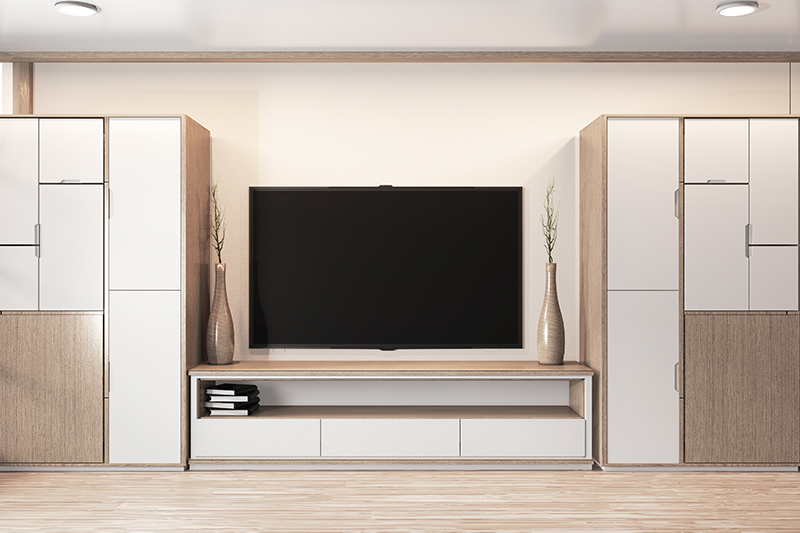 TV stand wardrobe design that comes with identical wardrobes on the side and a ledge-cum shelf at the bottom.