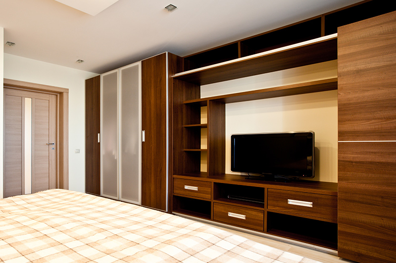 Bedroom wardrobe design with tv unit which makes the most out of your designated wardrobe space