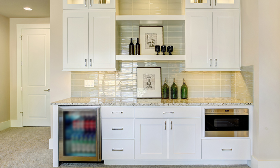 Inbuilt Home bar cabinet that fits well in a wonderful white minimalistic kitchen