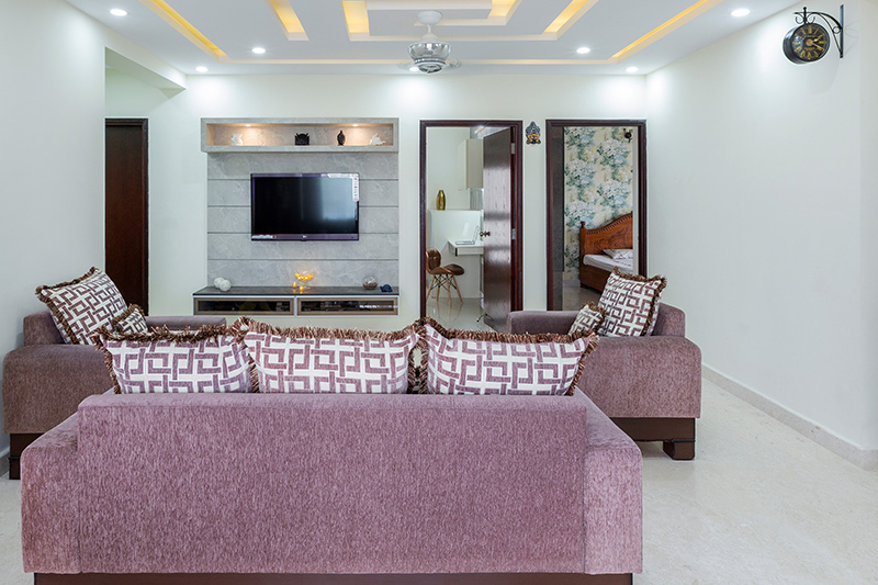 Small house living room design adds geometric-structured false ceiling that looks a lot like a character and style.