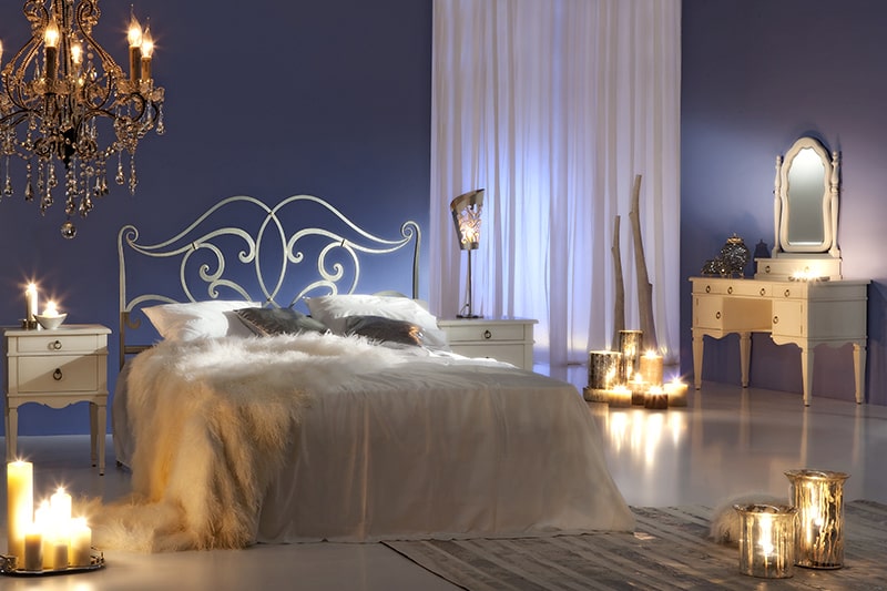 Sexy bedroom decor and design using candles and chandeliers to add a romantic vibe to your bedroom.