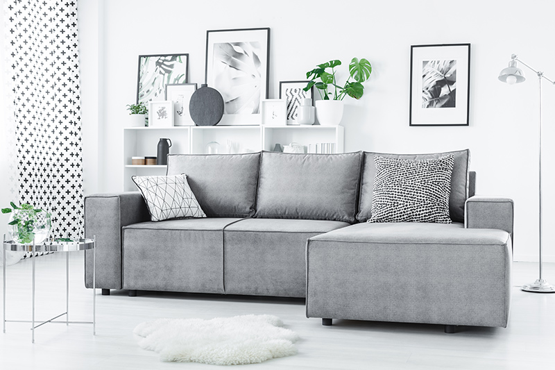 Corner sofa design for small living room that is minimalistic and helps maximise your living room area.