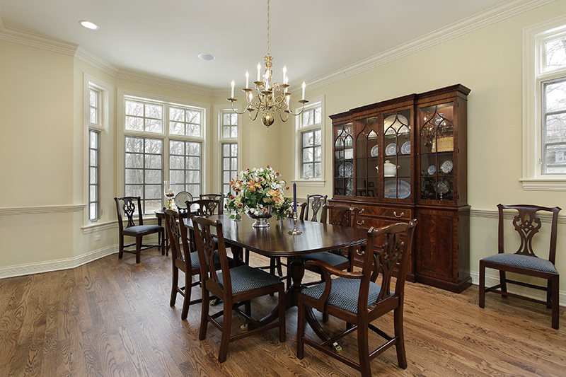 Cream paint colours for walls with a classic wooden cabinet and a chandelier and a warm cream with cream wall paint