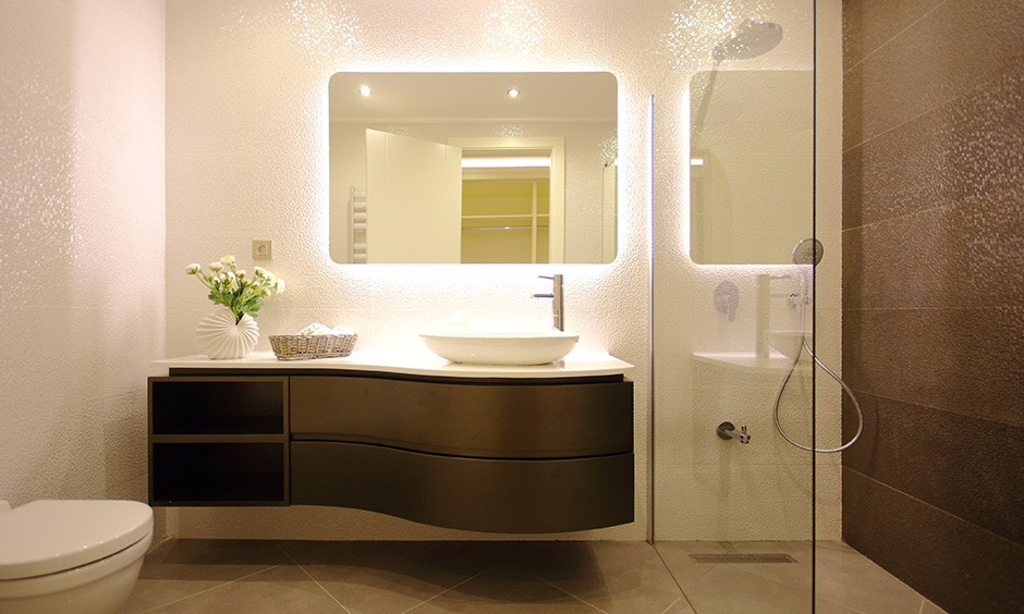 Designer bathroom sink made of dark wood that makes an elegant statement