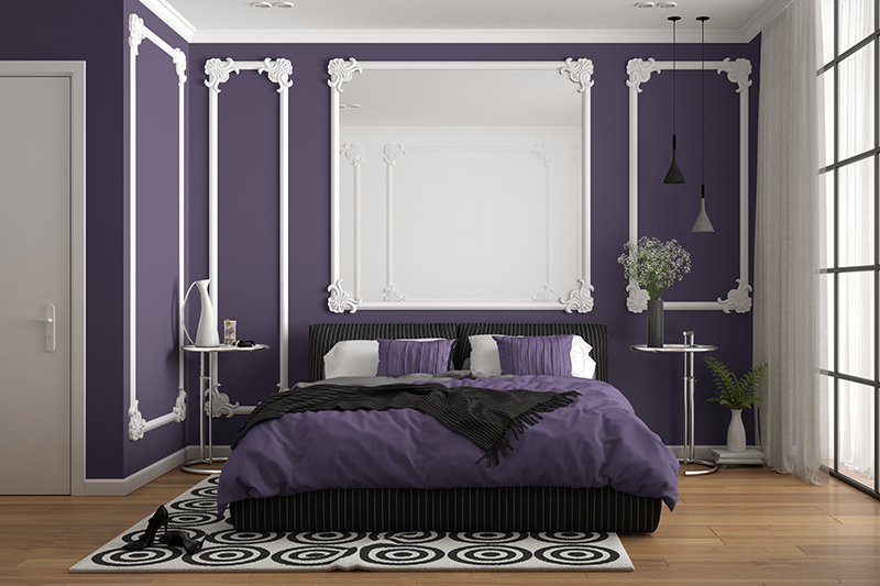 Purple bedroom colours with white wall mouldings and bedding pairs gives the purple bedroom a touch of elegance