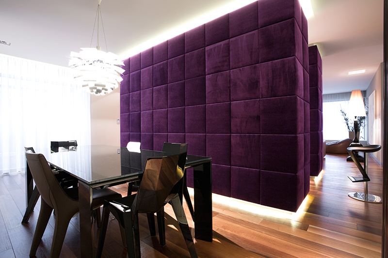 Partition of purple colour room with a rich velvet upholstered