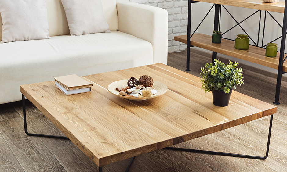 Wood plank table top and iron legs make this rustic style coffee table home highly durable.