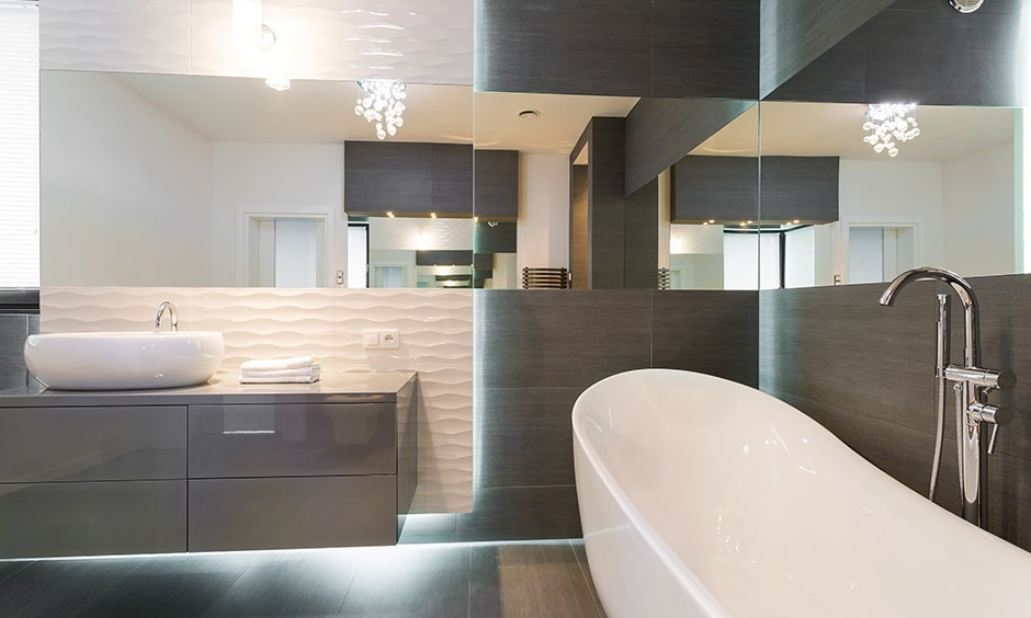 Sophisticated bathroom lightings with a wall mounted lamp right above the mirror bathroom ceiling lights