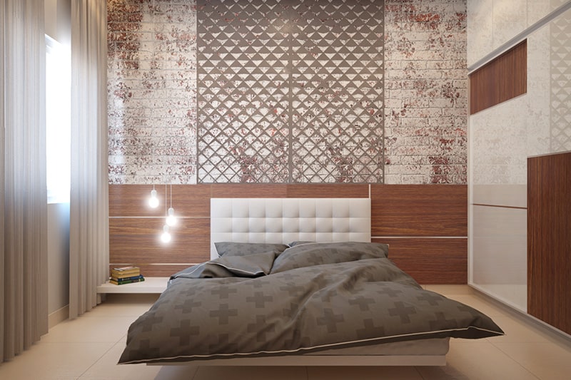 A tufted white headboard stands out in this bedroom design