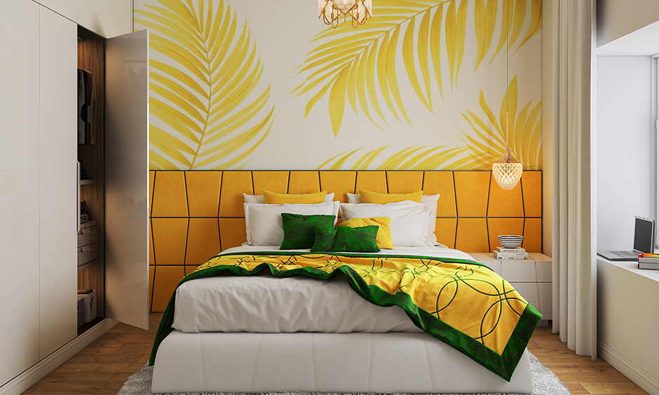 Bedroom accent wall with a large floral wallpaper with scaled-up petals in yellow colour