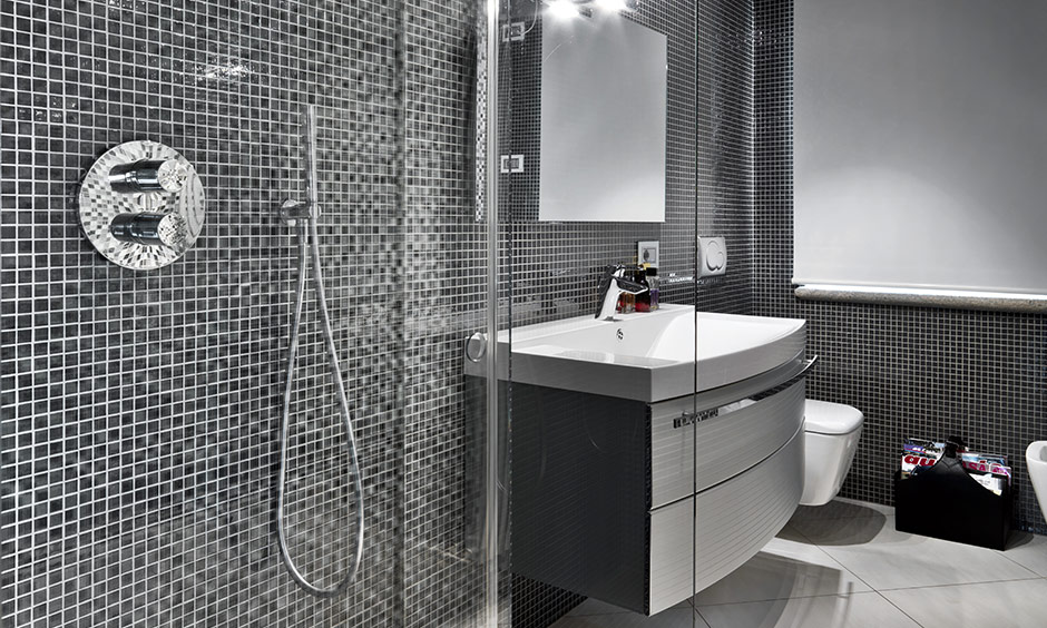 Black and white mosaic tile walls of bathroom design looks spacious