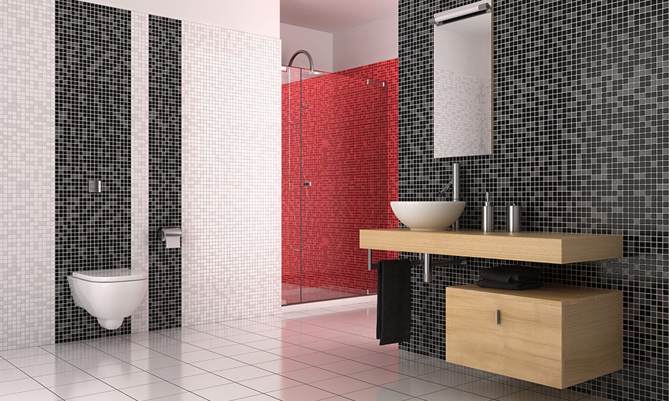 Black and white mosaic tile bathroom design with a pop of colour with red