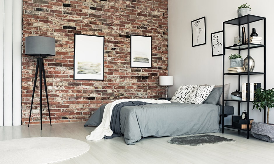 Brick wall texture bedroom design creates a cosy yet artistic feel