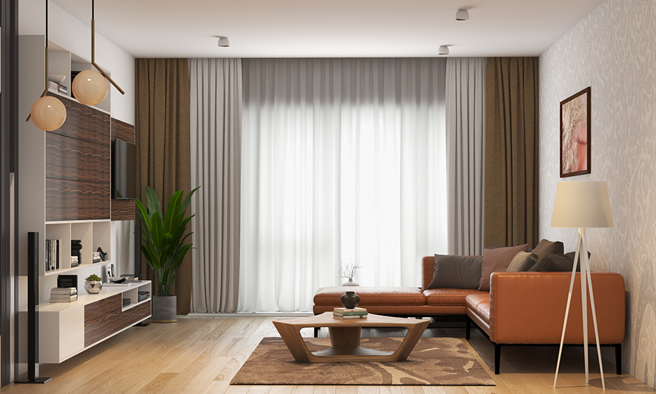 Brown wall colour which does well with brown furniture with whhite ceiling with leather sofa and white tv cabinet