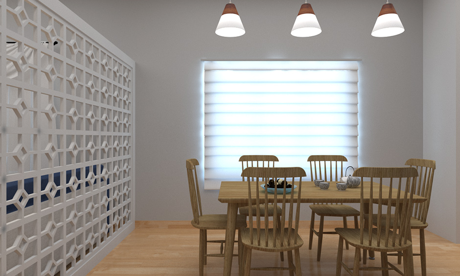 Simple cone hanging lights for dining room with the white partition with lattice work on one side.