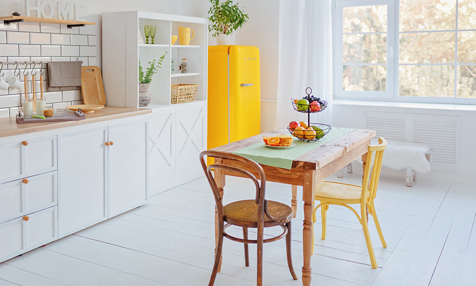 Dining room design that has a country style small wooden dining table made of timber