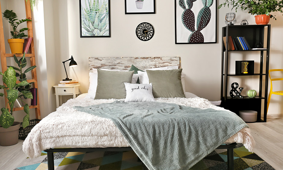 Cozy comfy bedroom decor with furry blankets, a geometric patterned rug and gingham pillows stands out.