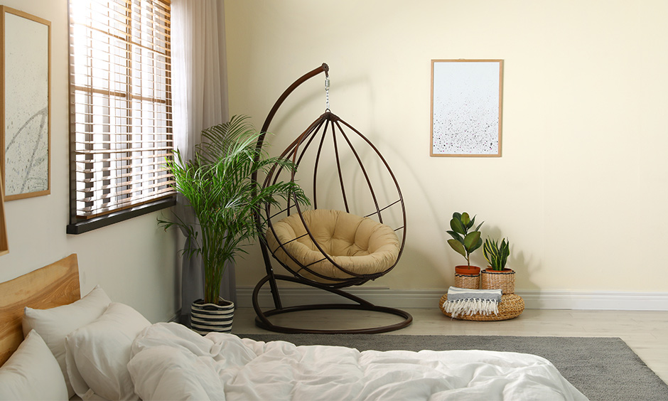 Cozy room with a swing chair is a perfect place to take an afternoon nap.