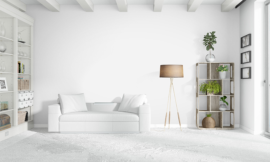 Cozy minimalist living room with all white colour with different shapes, textures, and elements