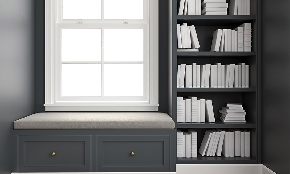 Corner window seat ideas add a bookshelf and set of drawers for some extra storage.