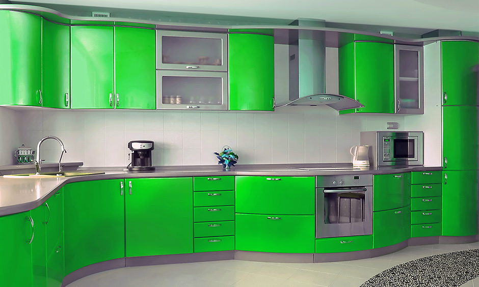 Bold electric green kitchen colors give the cooking area a futuristic look and instantly ups the energy.