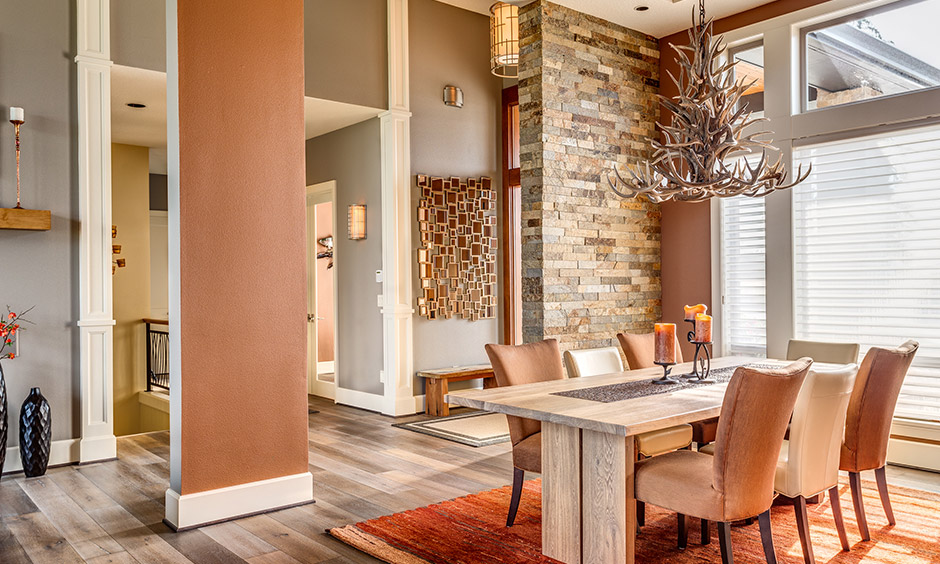 Brick dining wall decor brings in a rustic touch to the space and a feeling of natural outdoors.