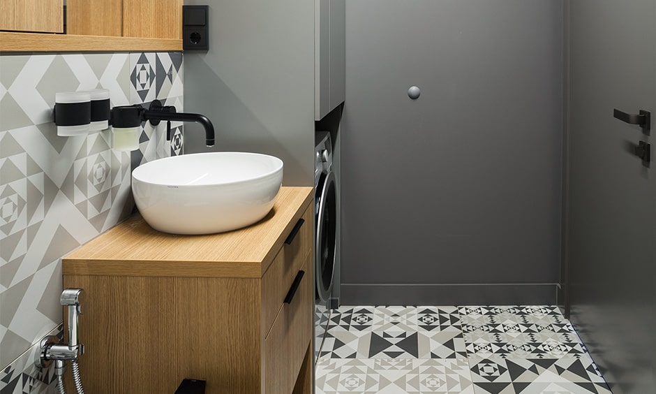 Use geometric patterned tiles for black and white bathroom design for a seamless look