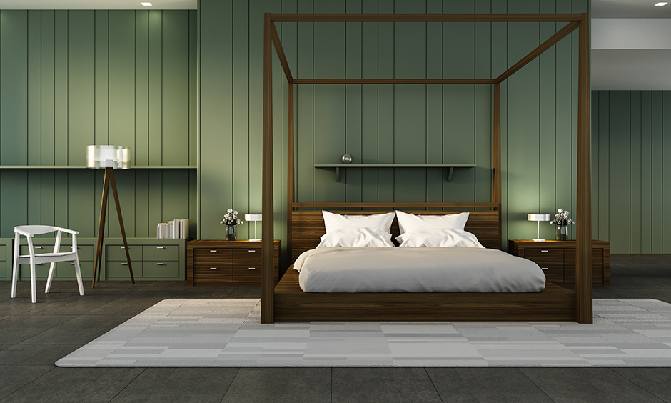 A single striped green accent wall bedroom with a wooden bed