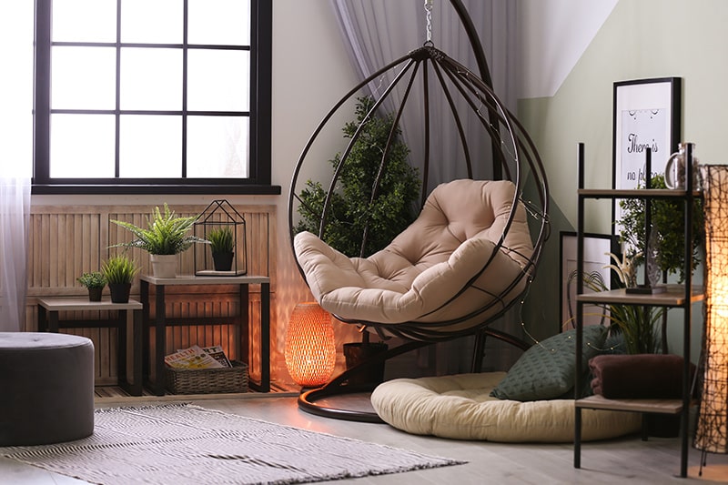 Decor your reading corner with the elegant glass floor lamp and hanging armchair for your home