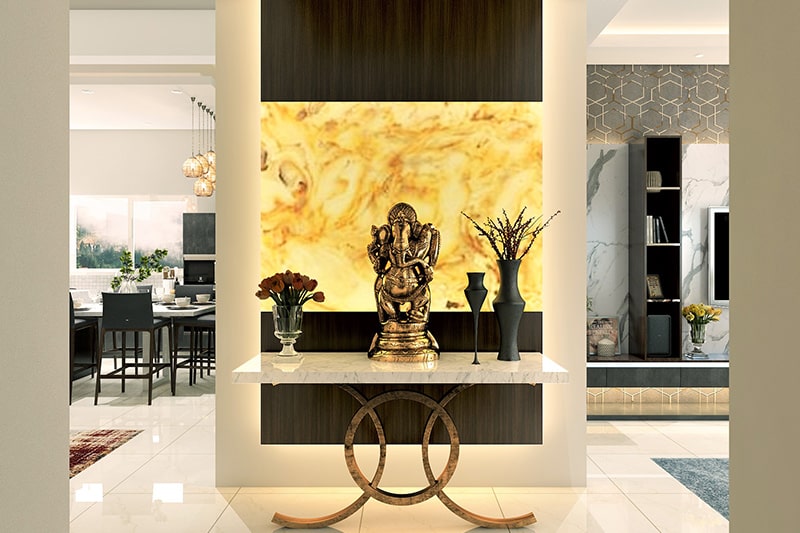 Home entrance decor with the ganesha idol and white marble-top side table stand