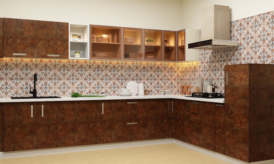 A L-shaped kitchen layout with rustic deep brown and glass cabinets and patterned tile backsplash