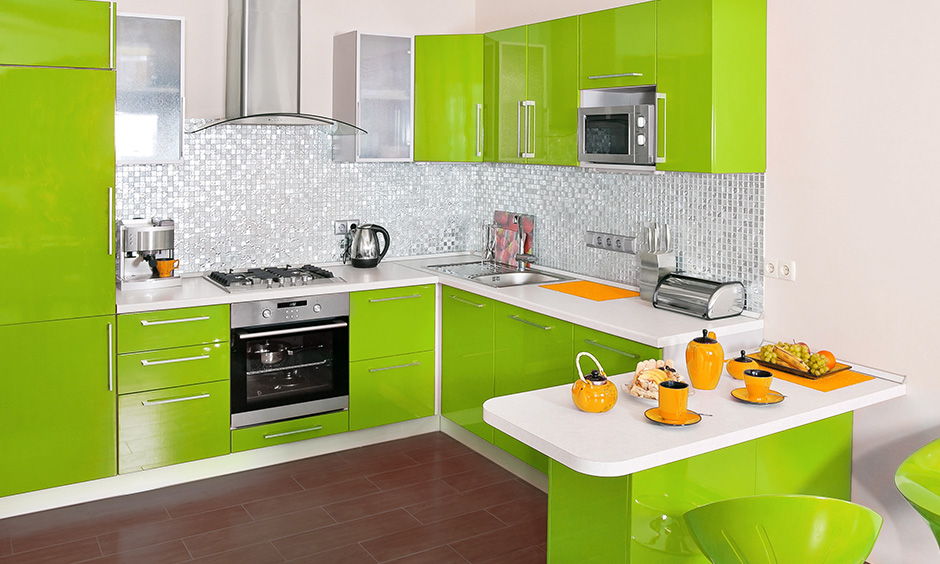 Lime green kitchen cabinets with plain white countertop give the vibrant and lively feeling.