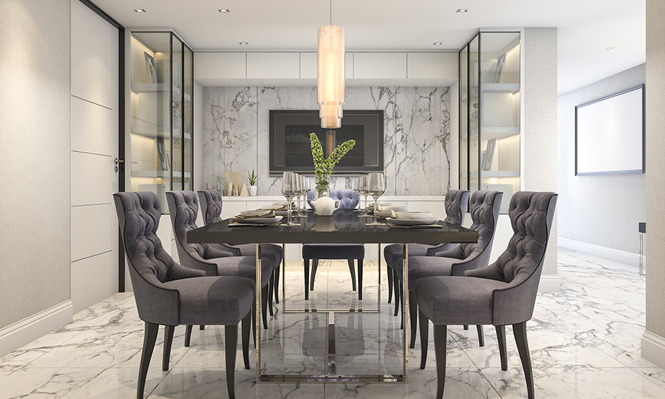 Dining wall decor with marble brings a smooth, shiny, and glamorous look.