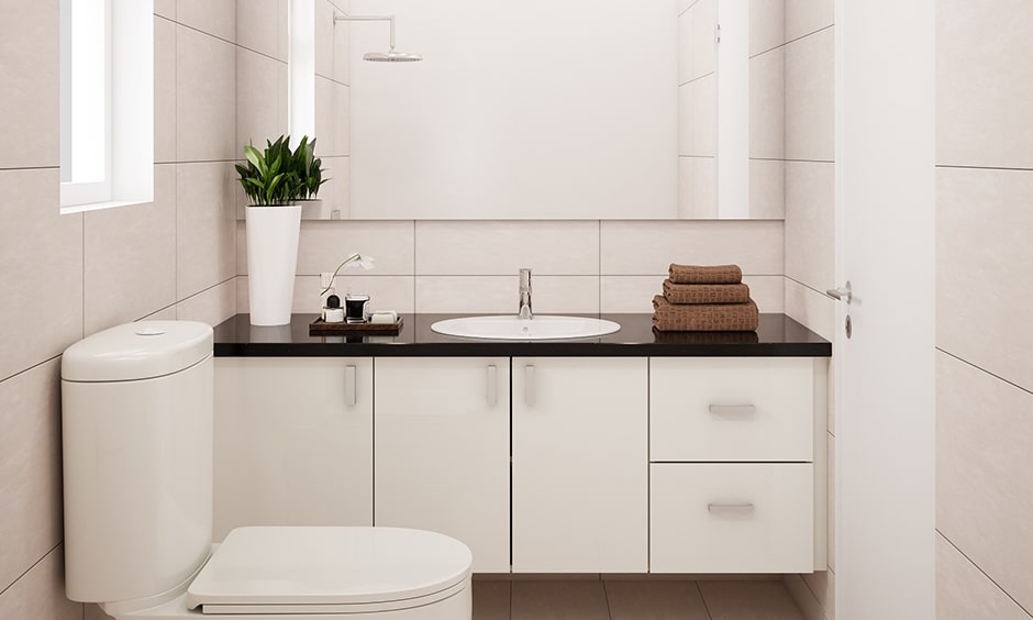 Black and white bathroom design with a black marble top gives your bathroom sleek look