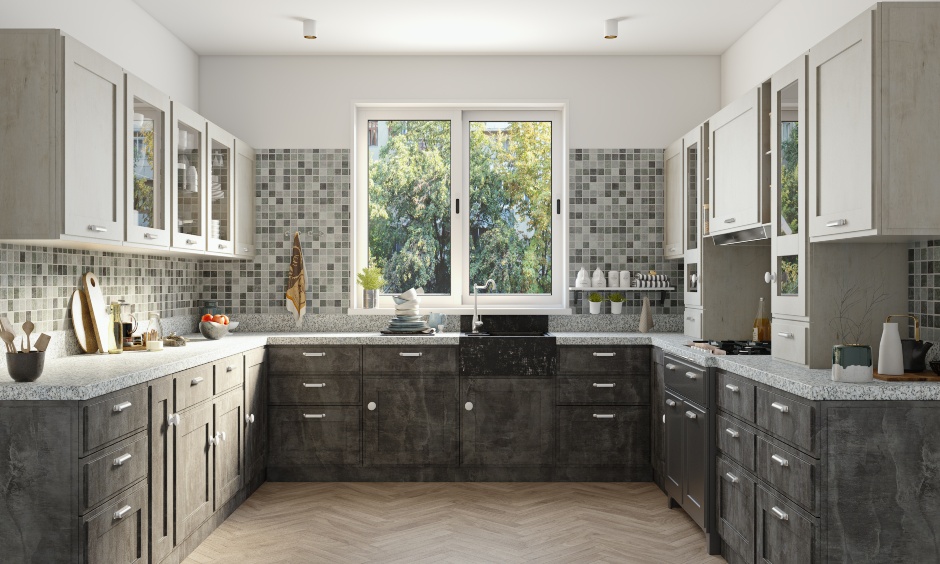 A light grey kitchen with light grey granite countertop and modern rustic kitchen cabinets in stone textured laminate.