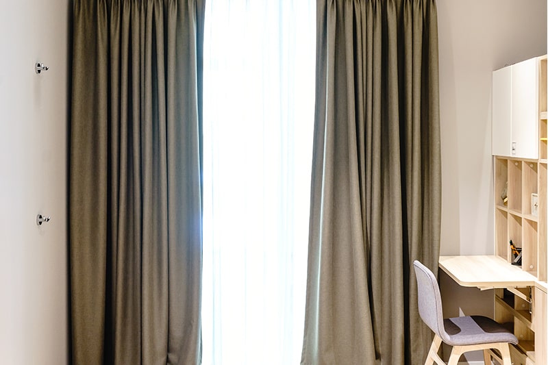 Curtain design for study room with pinch pleated drapes on a ring-top rail look beautiful