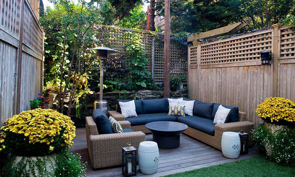 Small home garden design where you can spend quarantine time in quality with comfy sofas and a simple round table