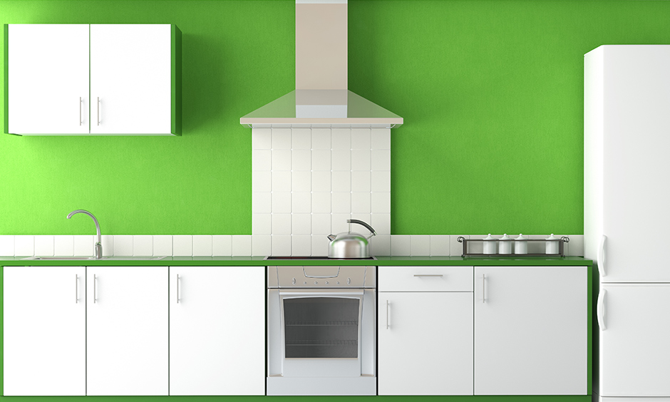 Green kitchen walls and white kitchen cabinets colour combination is the easiest on the eye.