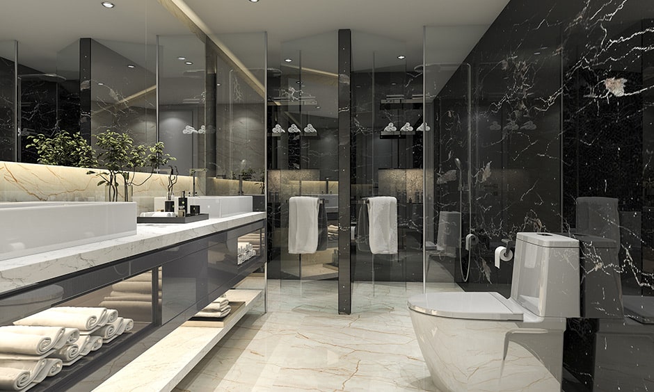 Modern black and white bathroom interior with a white marble floor paired with a black marble wall