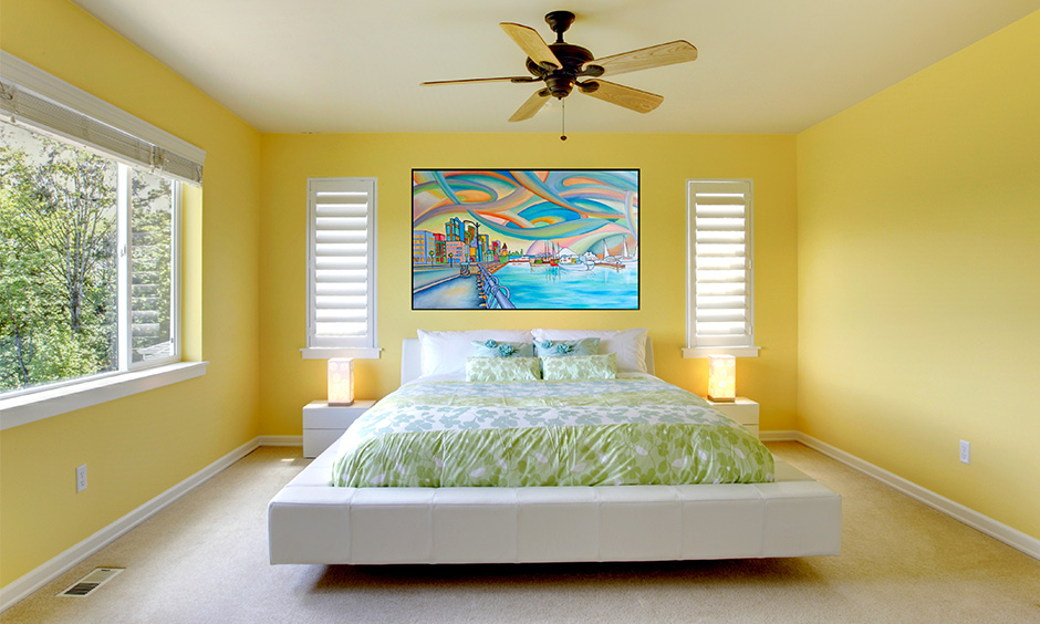 Yellow bedroom walls will remind you of a sweet summer day.